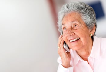 Portrait of a happy senior woman on the phone